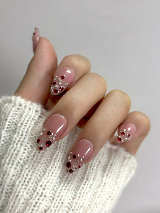 Blush Pink Almond Nails with Ruby Crystal Accents