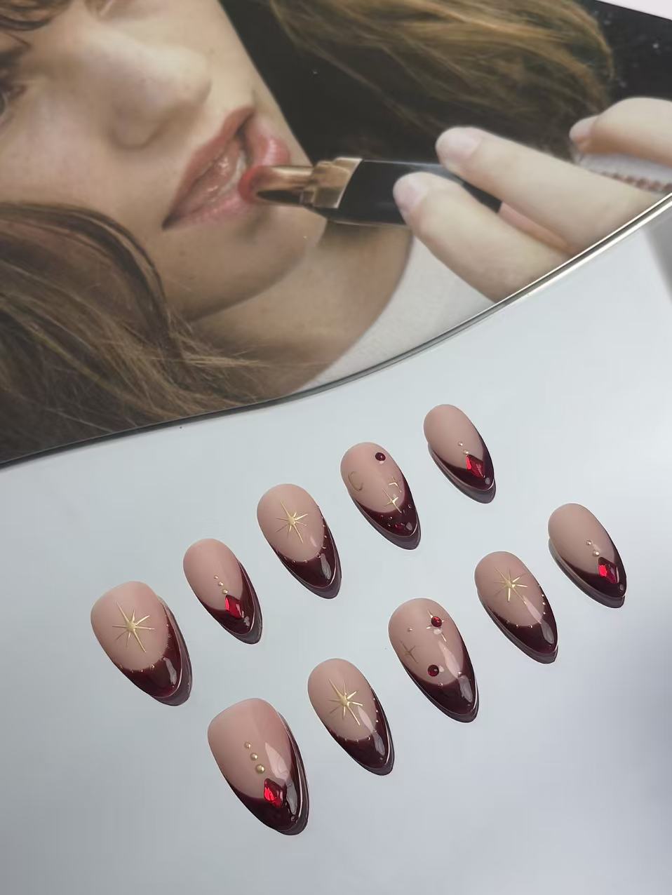 Burgundy French Almond Nails with Gold Accents