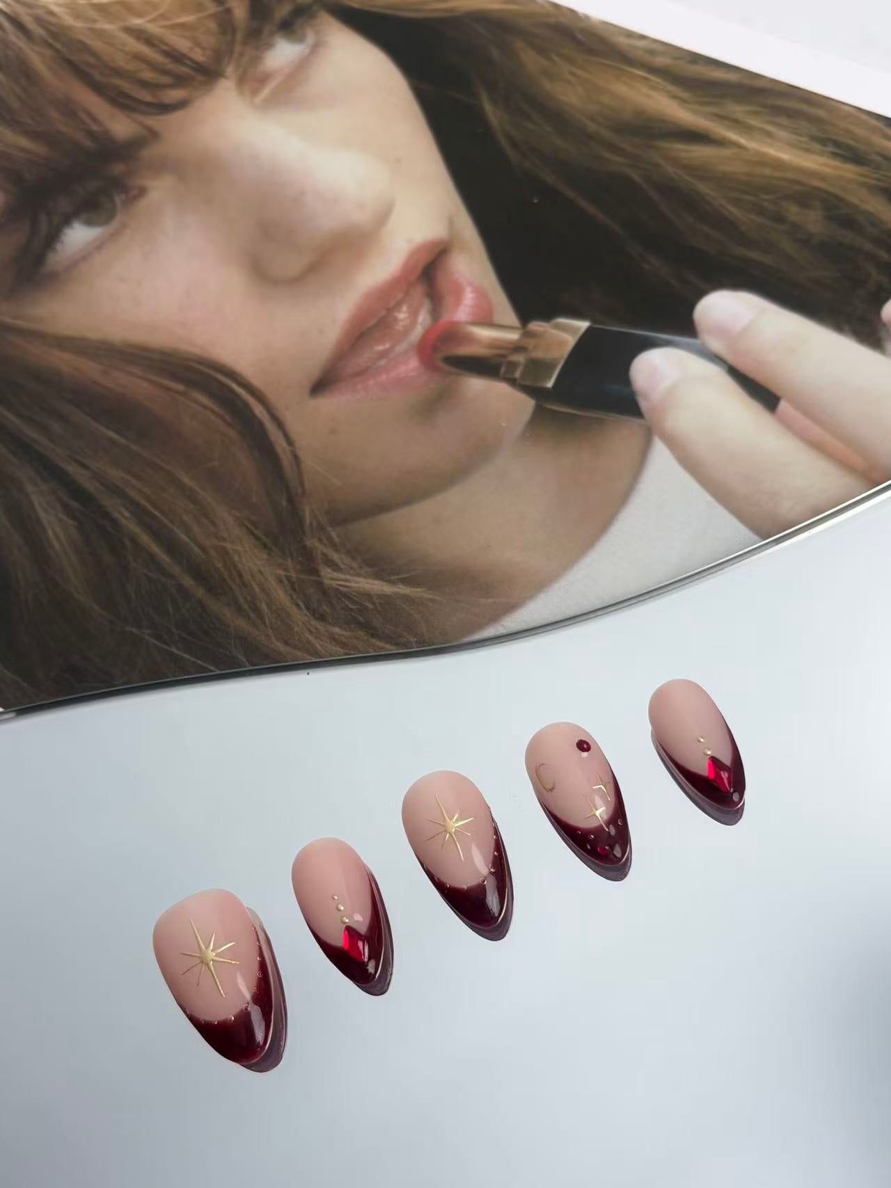 Burgundy French Almond Nails with Gold Accents