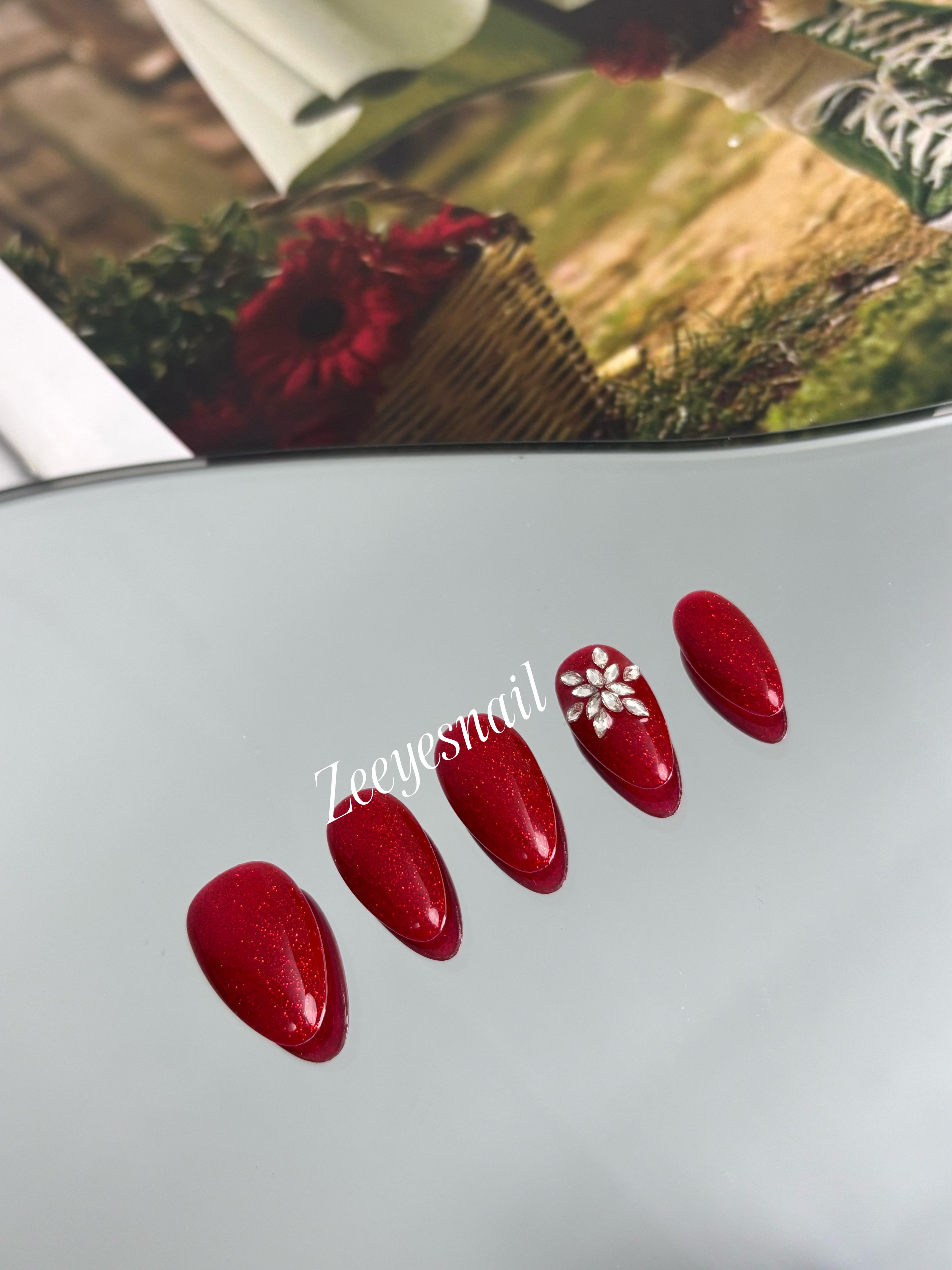 Festive Red Sparkle Almond Press-On Nails with Floral Accents