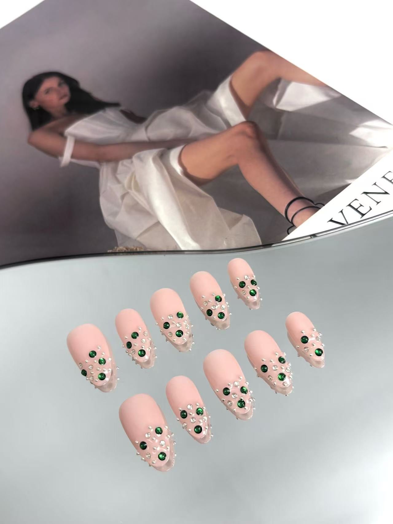 Blush Pink Almond Nails with Emerald Crystal Accents