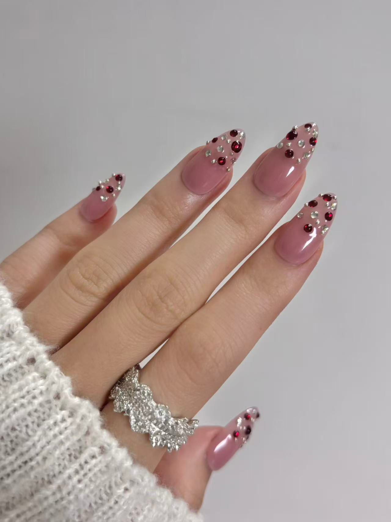 Blush Pink Almond Nails with Ruby Crystal Accents