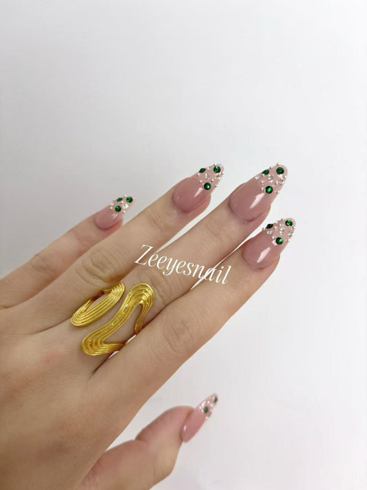 Blush Pink Almond Nails with Emerald Crystal Accents