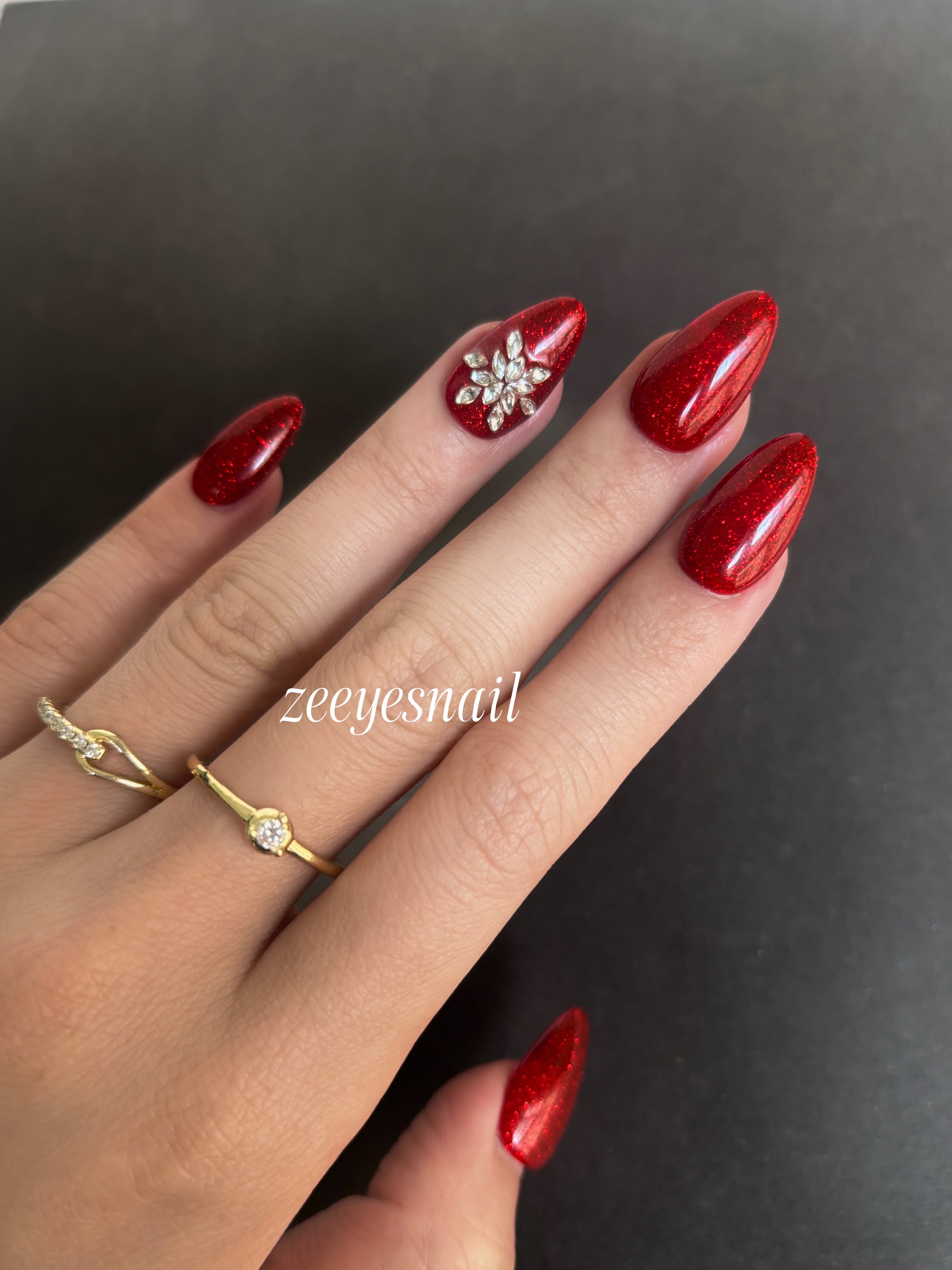 Festive Red Sparkle Almond Press-On Nails with Floral Accents