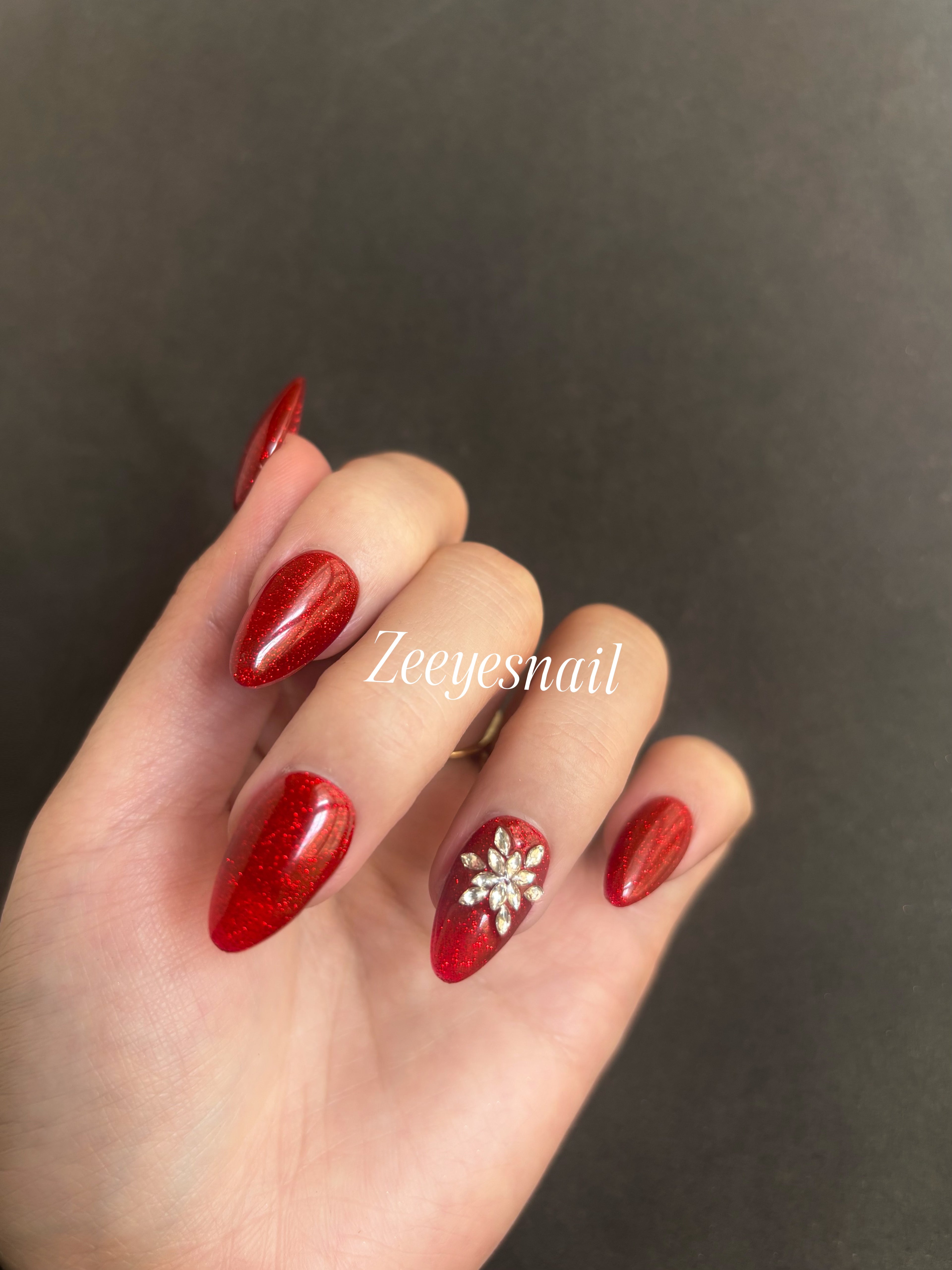 Festive Red Sparkle Almond Press-On Nails with Floral Accents