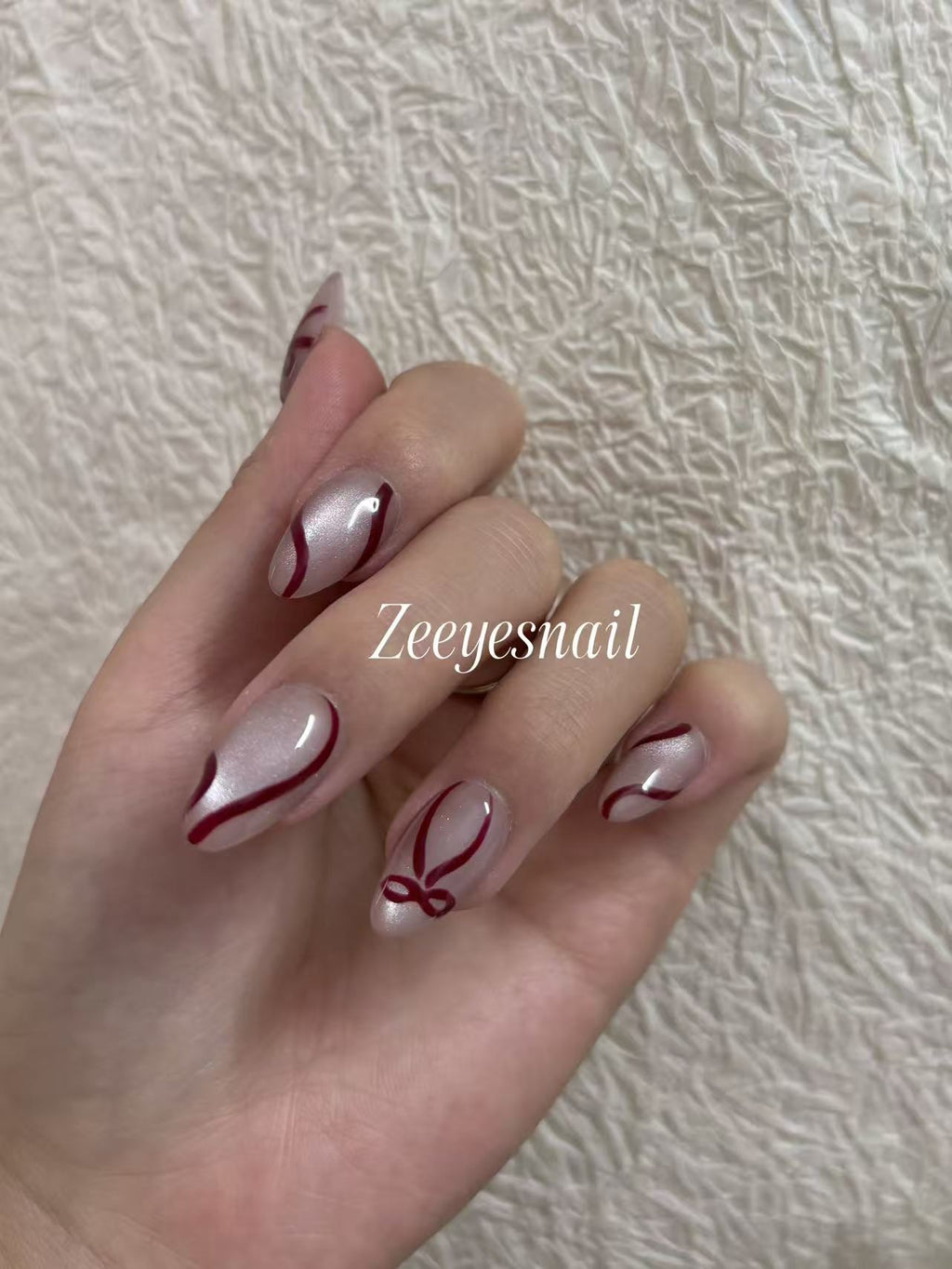 Ribbon Line Almond Press-On Nails – Elegant Shimmer Design